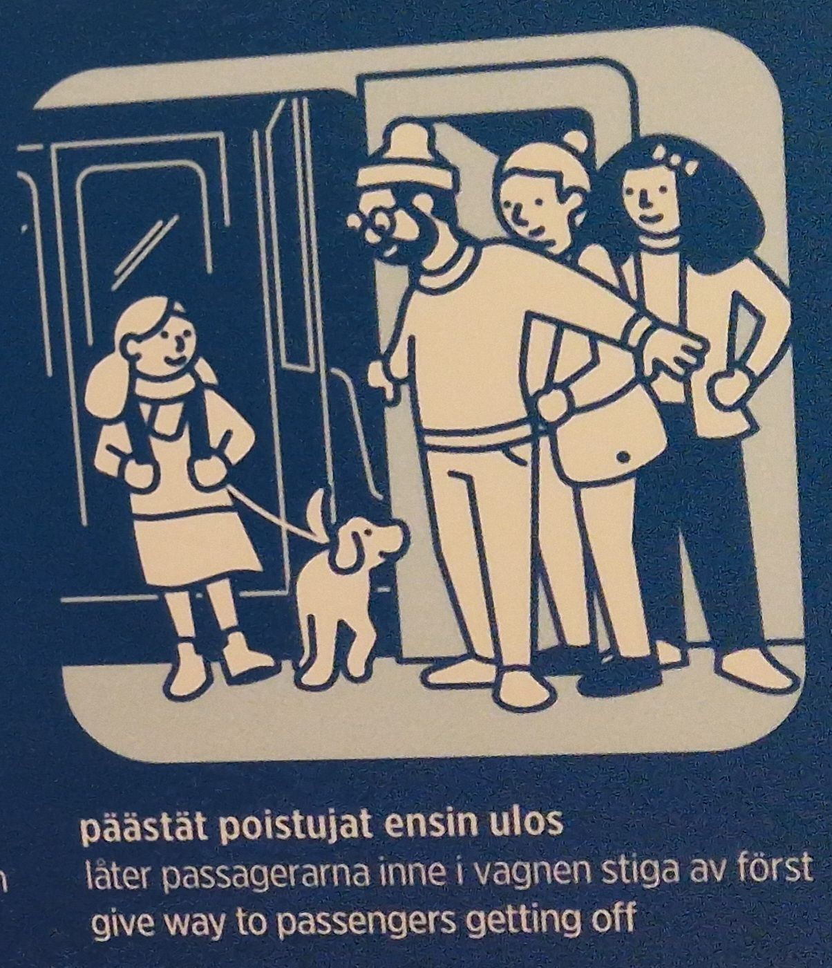 Vaunusta astuu ulos nuori ja koira. Avoimen oven vieressä seisoo kolme hahmoa, joista ensimmäinen antaa selkeästi tietä nuorelle ja koiralle. Alla lukee teksti 'päästät poistujat ensin pois'.